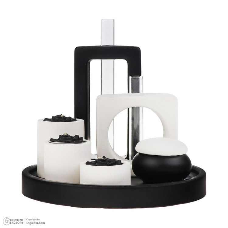 نمای نزدیک جا شمعی های بتنی سفید با شمع های سیاه در ست ۱۰ تکه رومیزی طرح کلاسیک